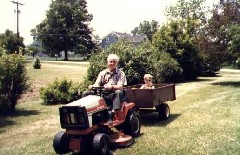 dad Bruce Dorrough; Ben Dorrough; driving Garden tractor